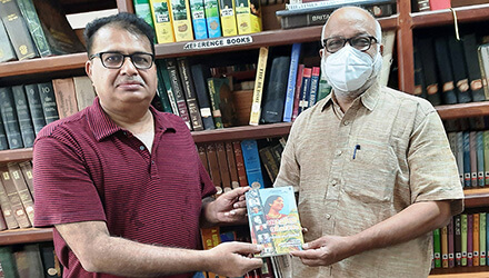 V K Cherian presents the book to the former Education Minister of Kerala M A Baby-Polit Bureau member of  CPIM.